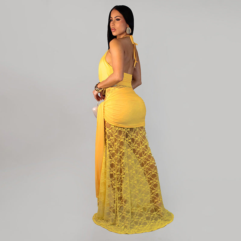 Yellow lace halter dress in side view with thigh-high slit