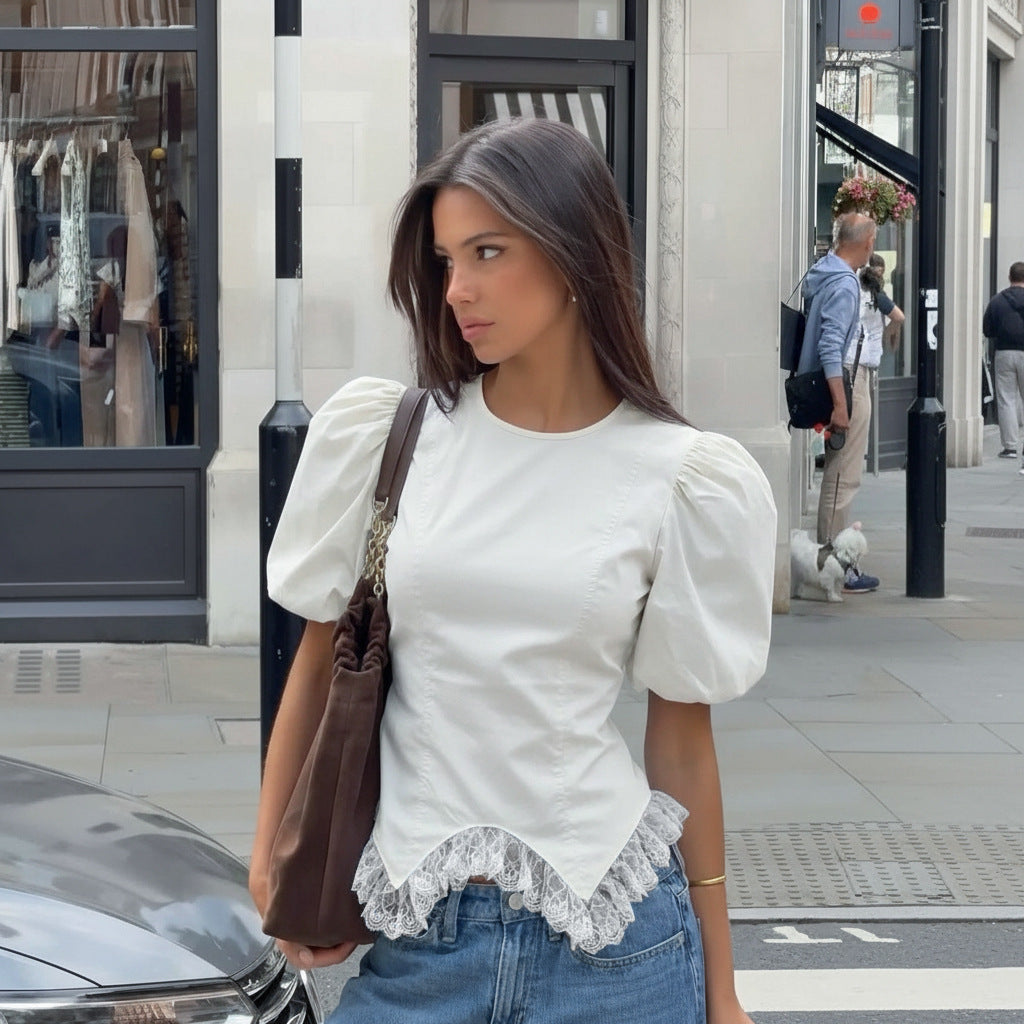 Women’s white fitted blouse with puff sleeves and lace-trim irregular hem