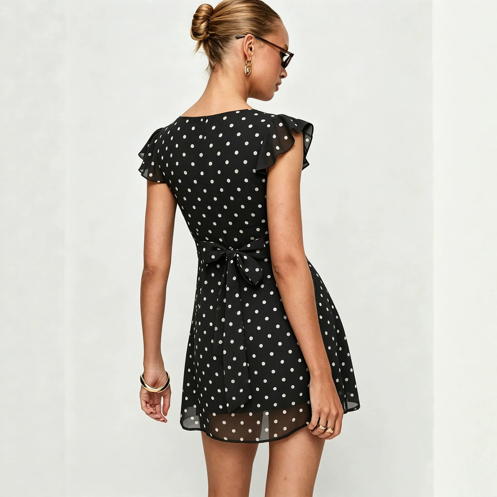 Black polka dot mini dress, back bow tie detail, short ruffle sleeves