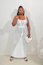 White lace maxi dress with square neckline, tie waist, and sleeveless eyelet pattern