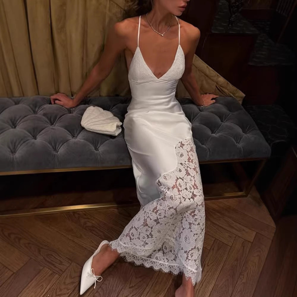 White lace backless slip dress with thin spaghetti straps and lace overlay at hem