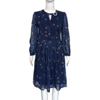 Navy chiffon long-sleeve dress with floral print and keyhole neckline, button trim
