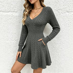 Gray knit V-neck dress with long sleeves and cable pattern skirt