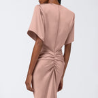 Pink satin sheath dress, back view with short sleeves and ruched back waist knot