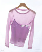 Pink long-sleeve top with faux camisole overlay and “SUNSET” print