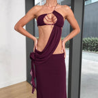 Burgundy halter maxi dress with open-back beadwork and draped waist detail