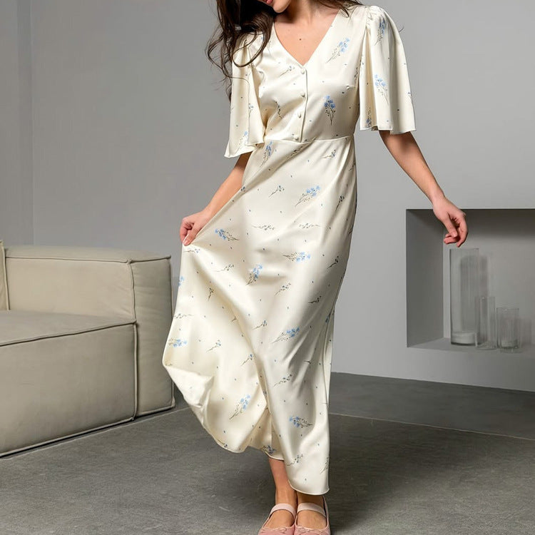 Ivory satin maxi dress with flutter sleeves, V-neck and wrap-style waist tie