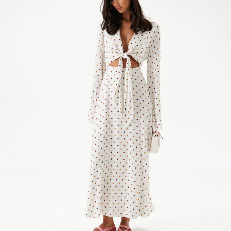 Women's polka dot long-sleeve dress with V-neck tie and flowing midi hem