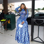 Blue floral long-sleeve maxi dress with high neckline and gathered tiered skirt