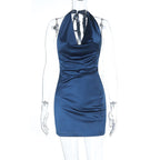 Dark blue satin halter sheath dress on mannequin with V halter neckline