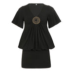 Women's black pleated short-sleeve dress with V-neck and gold-tone medallion center