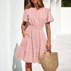 Pink short-sleeve summer dress with V-neck and tiered skirt