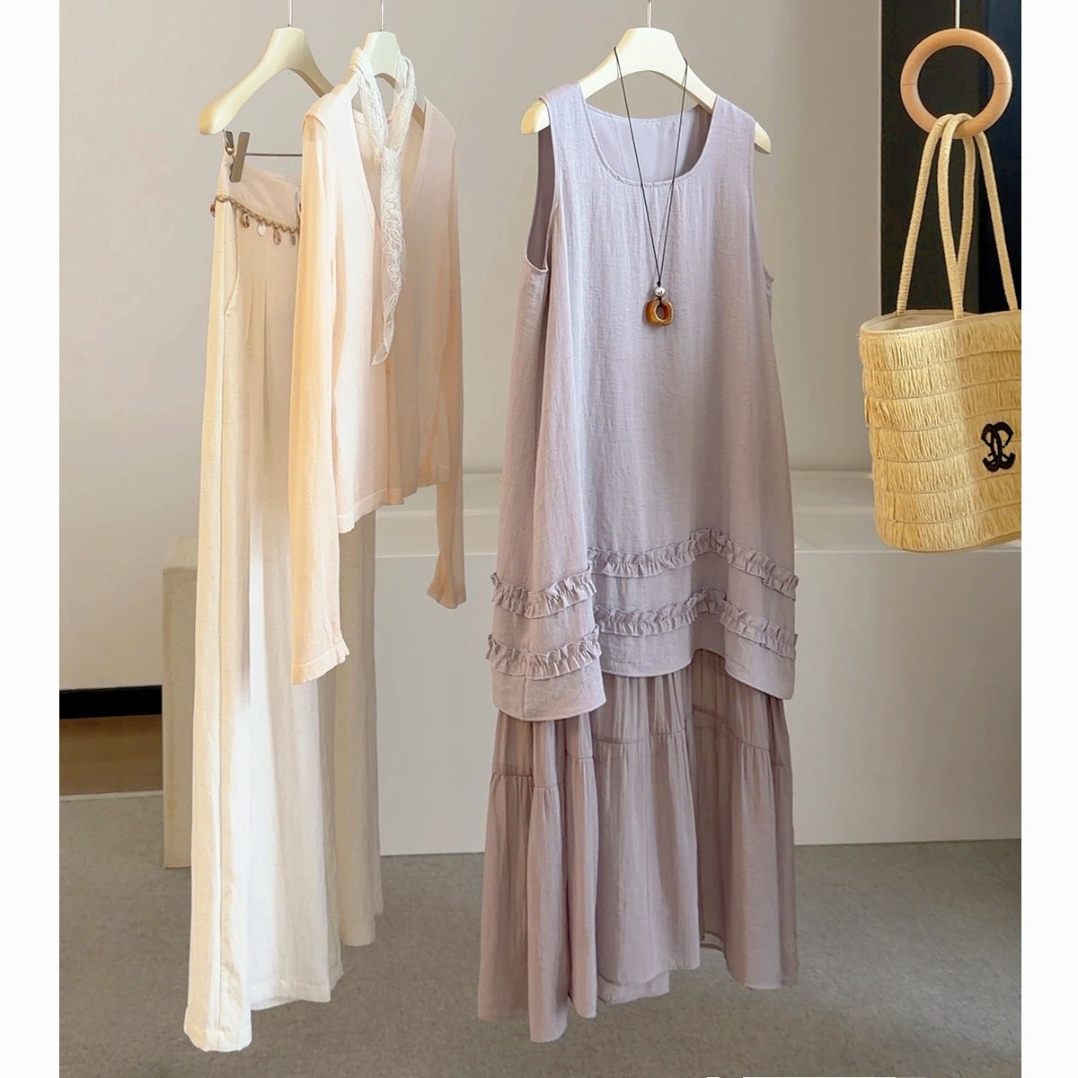 Lavender sleeveless summer dress with lace-trimmed hem and tiered skirt