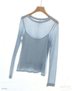 Light blue long-sleeve top with faux camisole overlay, sheer-looking sleeves