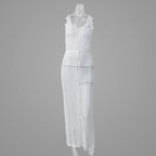 White knitted maxi dress with scoop neck, sleeveless design, and openwork pattern