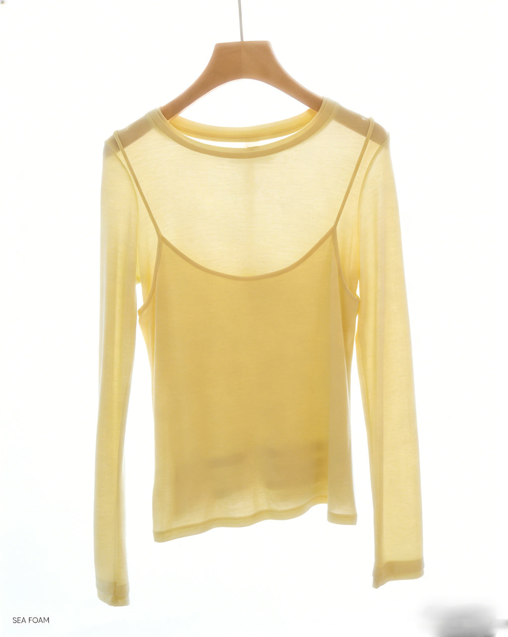 Pale yellow long-sleeve top with faux camisole overlay for layered look