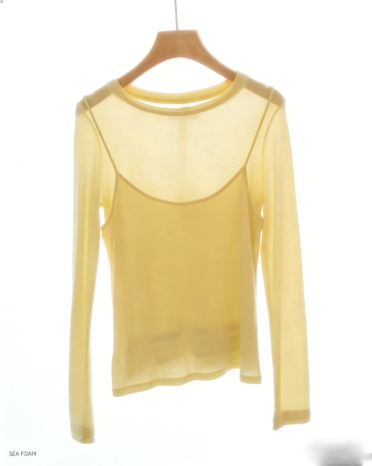 Pale yellow long-sleeve top with faux camisole overlay for layered look
