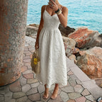 White casual summer dress with spaghetti straps and V neckline, side front view