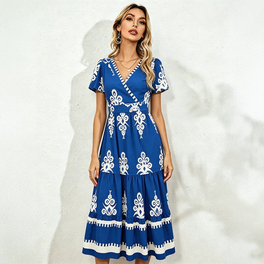 Blue midi short-sleeve dress with V-neck and white floral embroidery, tiered skirt