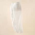 White wrap beach skirt with side bow detail and tiered ruffle hem