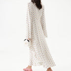 Women's polka dot long-sleeve dress with V-neck tie and full skirt hem