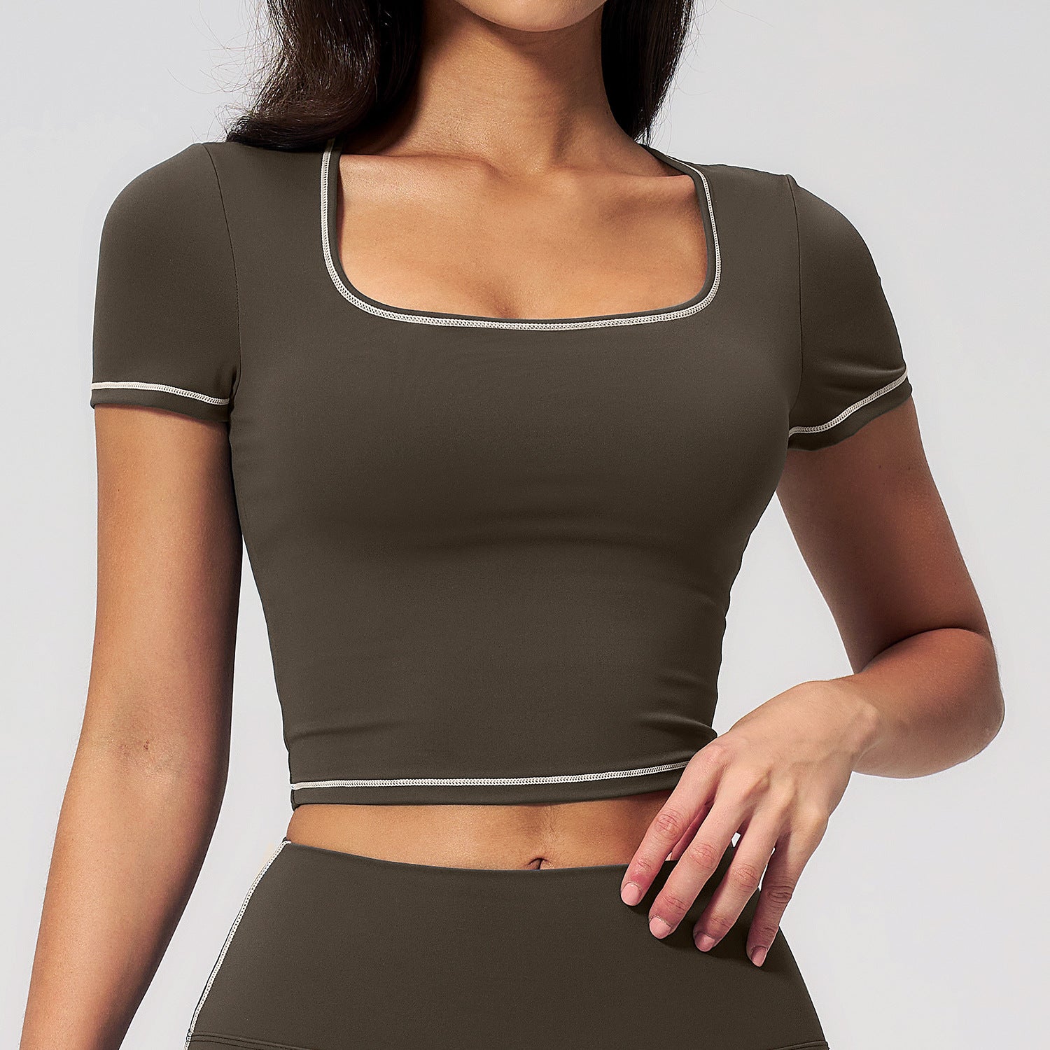 Olive cropped sports top with contrast trim and short sleeves