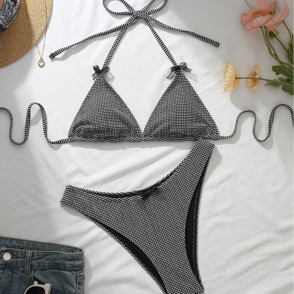Black-and-white check bikini with bow halter triangle top and matching high-cut bottoms