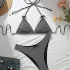 Black-and-white check bikini with bow halter triangle top and matching high-cut bottoms