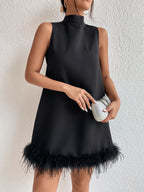Black sleeveless half-turtleneck dress with feather-trim frayed A-line hem