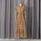 Khaki striped tiered lace dress on mannequin, button-front, tie waist, sleeveless
