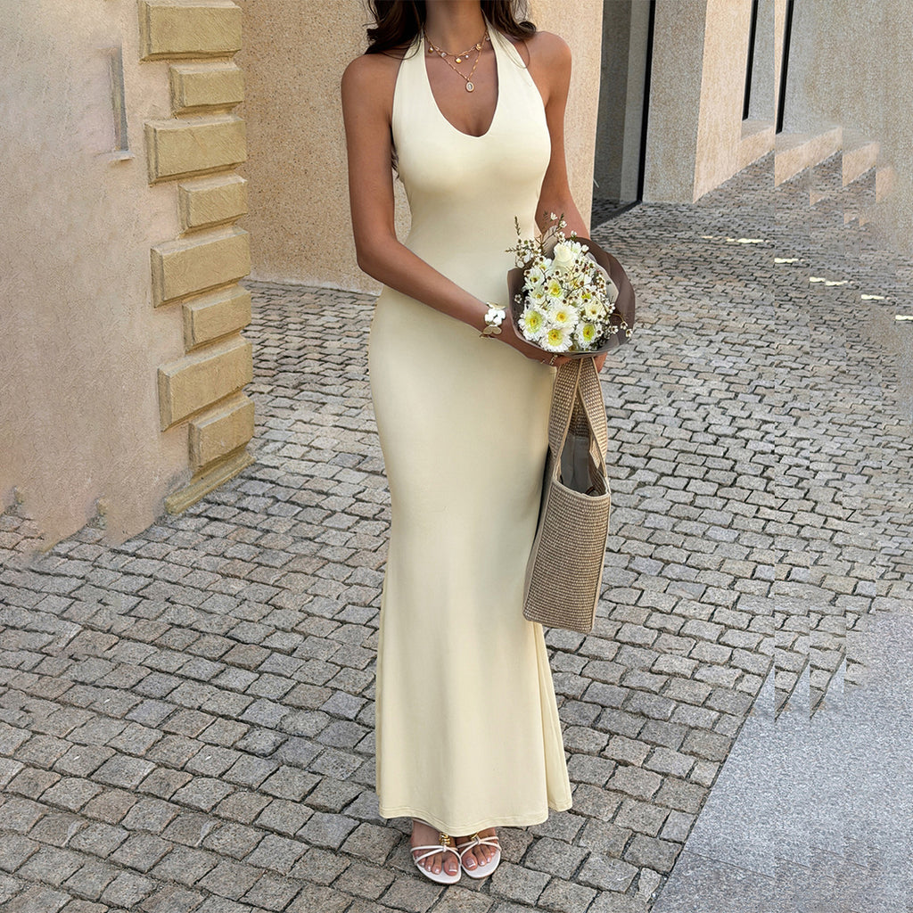 Cream sleeveless halter maxi dress with fitted bodice and V-neck front