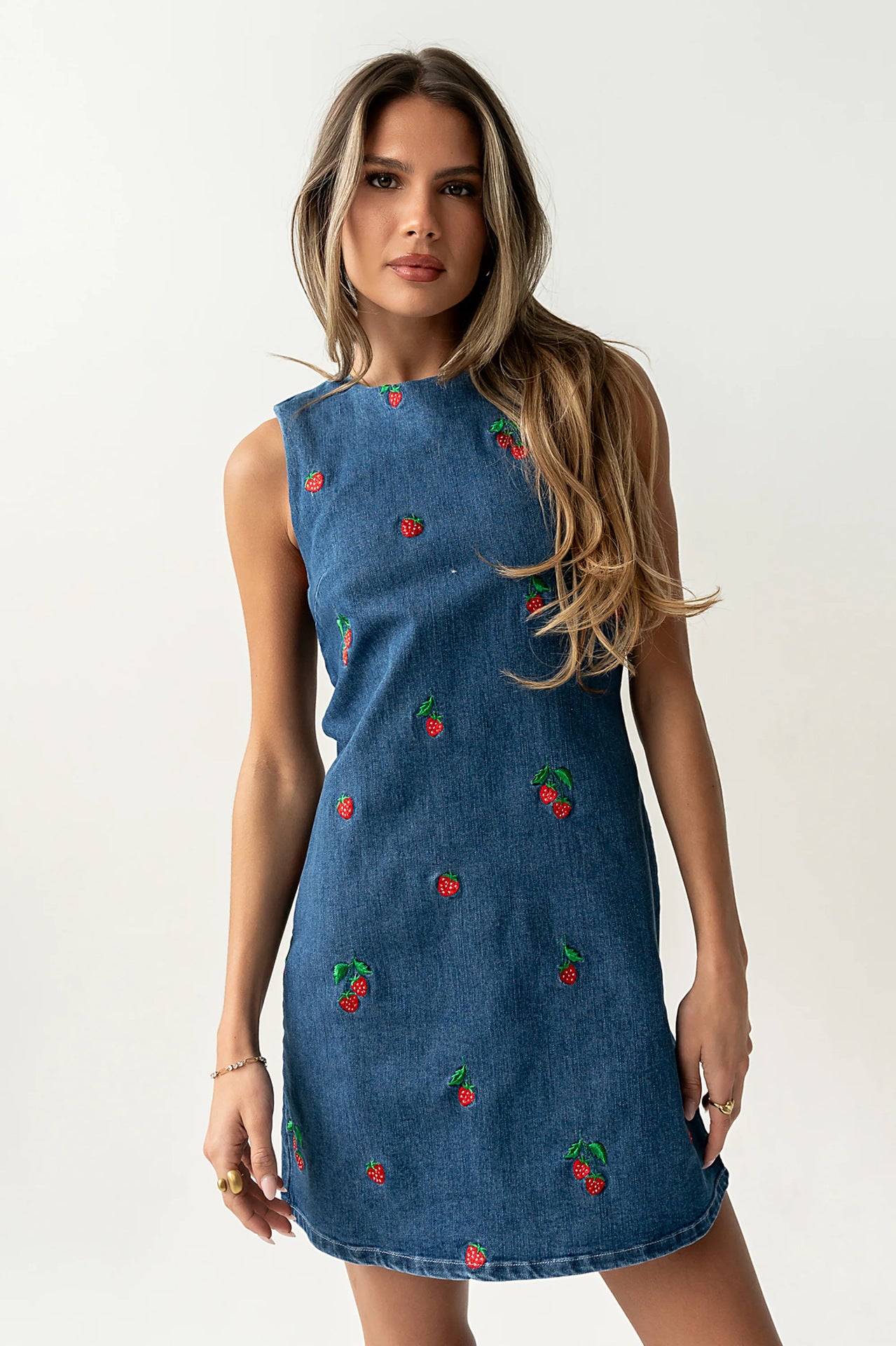 Blue denim sleeveless vest with red and green embroidery, sleeveless crew neck
