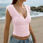Pink wrap V-neck sleeveless vest top with crossed neckline and fitted torso