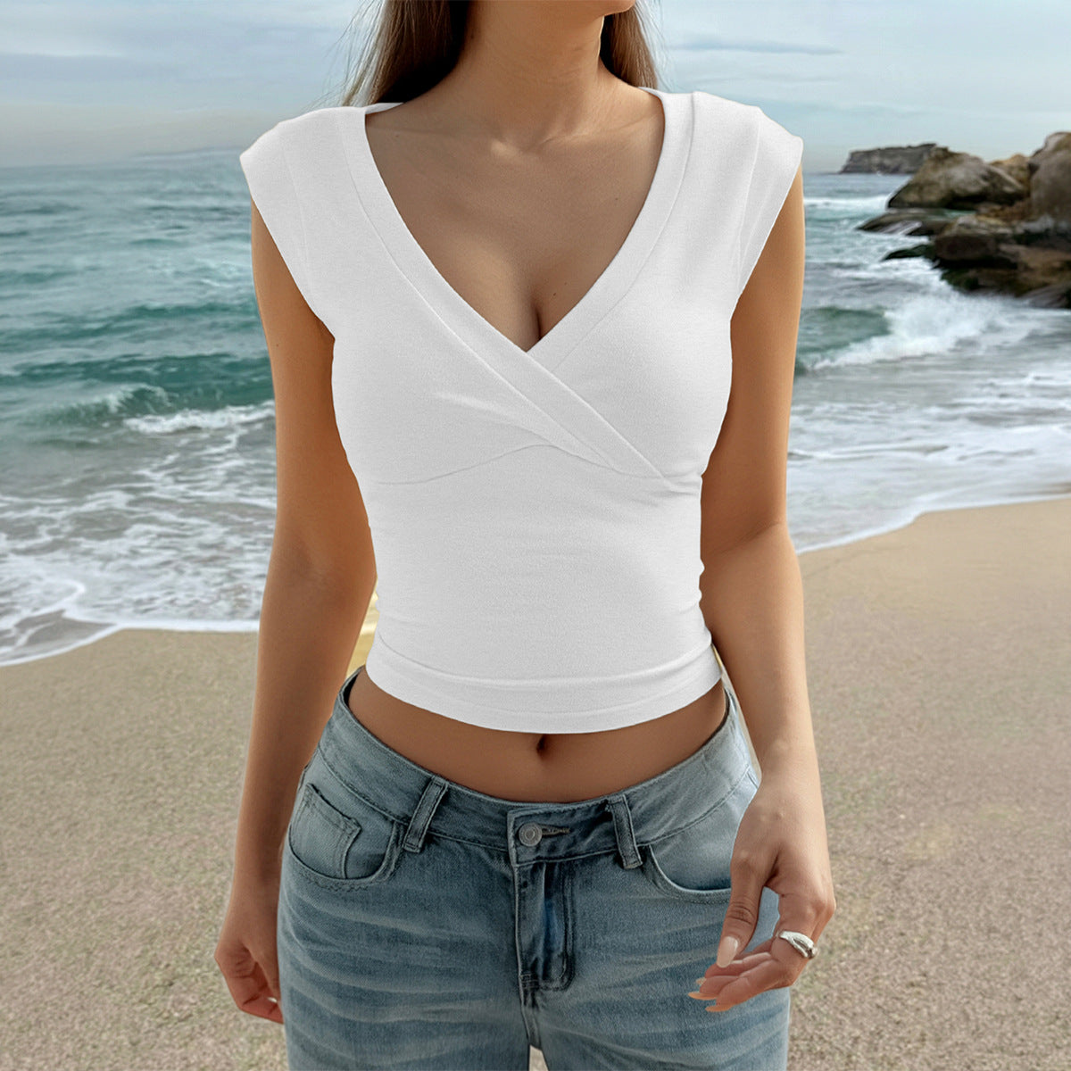 White V-neck sleeveless wrap top with crossed front and smooth jersey fit