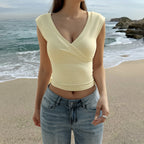 Cream wrap V-neck sleeveless vest top with crossed front and smooth fit