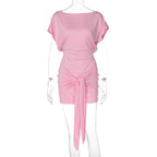 Pink off-shoulder sheath dress with draped skirt and ruched waist tie, short sleeves