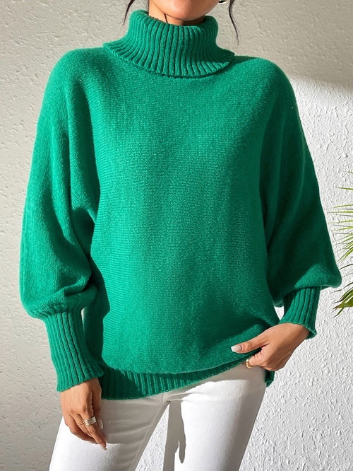 Green oversized turtleneck sweater with batwing sleeves and chunky ribbing