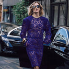 Navy lace long sleeve dress with gold-trim crew neckline, fitted midi silhouette.