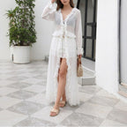 White one-piece swimwear, long-sleeve ruffle tiers and front button detail