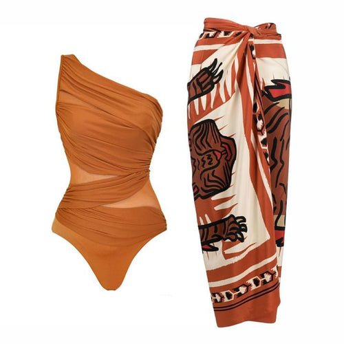 Rust one-shoulder ruched one-piece swimsuit, plus abstract patterned wrap skirt
