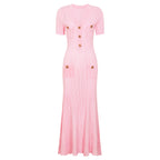 Pink ribbed maxi short sleeve dress with center decorative buttons and side seam pockets