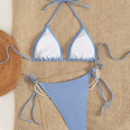 Blue backless bikini one-piece set with white triangle cups, halter ties, high-cut bottom