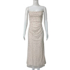 Cream dot-print slip dress with spaghetti straps and ruched bust
