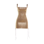 Metallic gold mini dress with thin straps, square neckline, and tie-hem strings