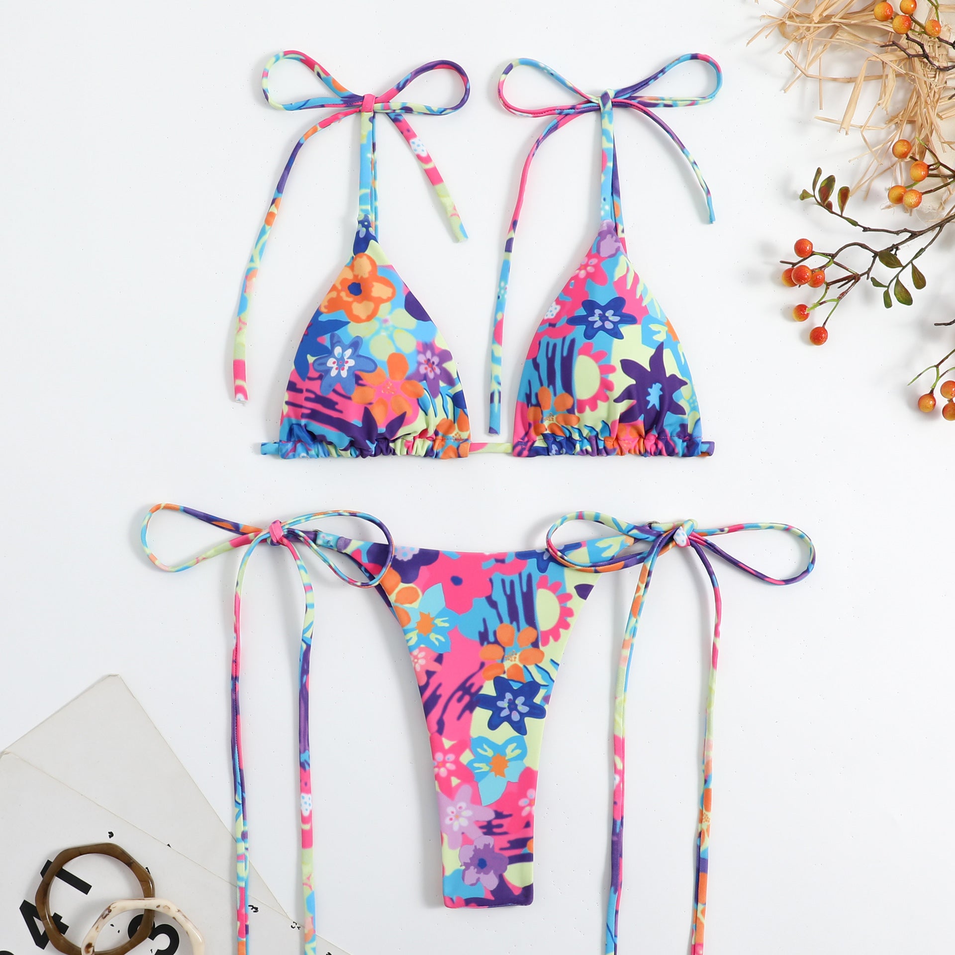 Blue floral triangle bikini with multicolor tie straps and high-cut matching bottom