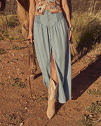 Light blue denim straight-leg pants with front buttons and side slit
