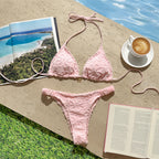 Pink floral-embroidered triangle bikini top with matching high-cut bottoms