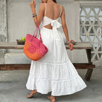 White lace sling maxi dress with open back bow tie and tiered hem