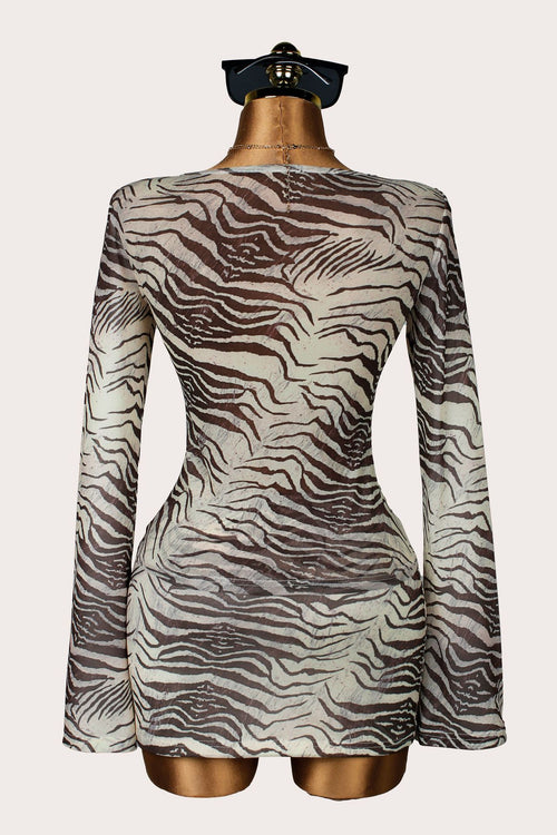 Back view: brown zebra-print long-sleeve top and mini skirt two-piece set