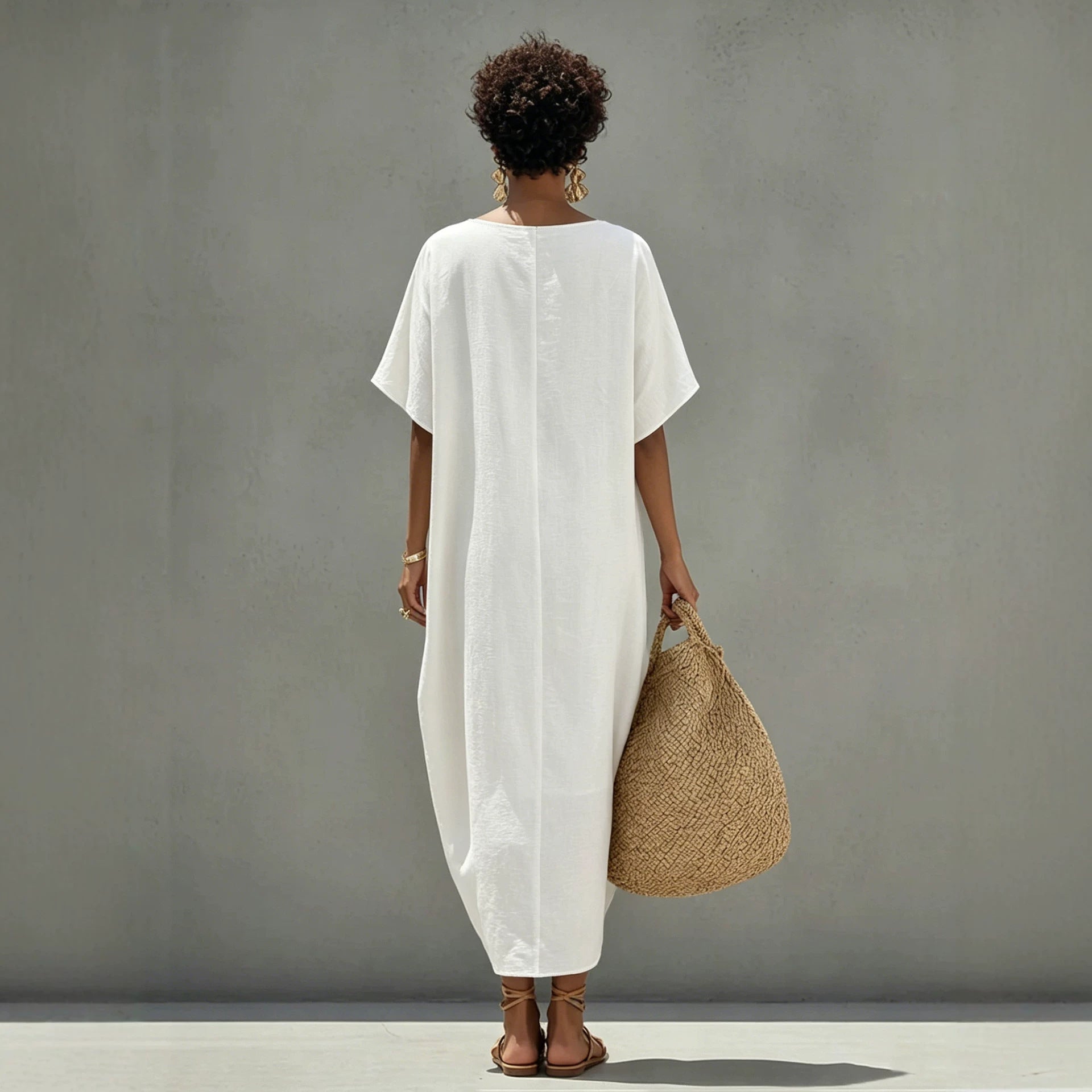White mini shift dress with short sleeves and round back, straight draped hem